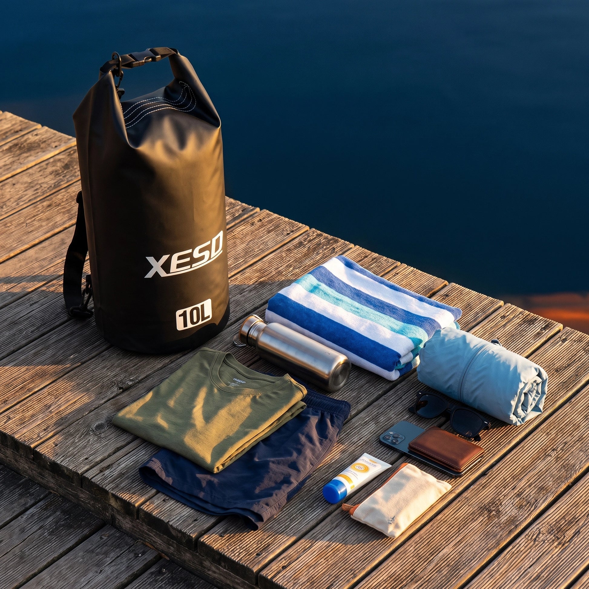 DryDock X-Series 10L Black Dry Bag with a change of clothes, towel, water bottle and rain jacket it can carry